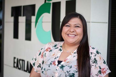 Gloria J. Woman standing outside of TTCU Eastland Branch