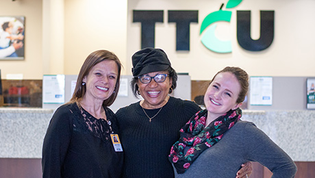 Mearl H. Mearl with employees at TTCU