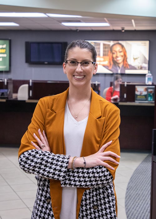 Woman standing in front of teller counter